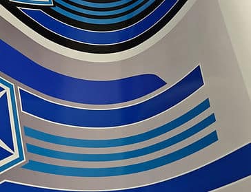 An image of a custom vinyl design being printed on a large format printer in water based ink